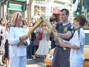 The torch handover from Liz Twose to Jacob Brownhill